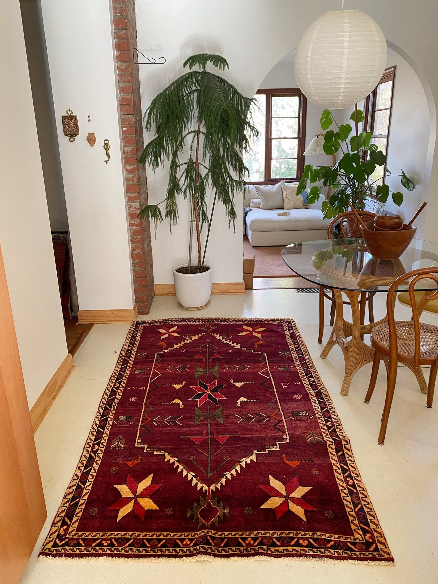 See Vintage Persian Area Rug in a Dining Room