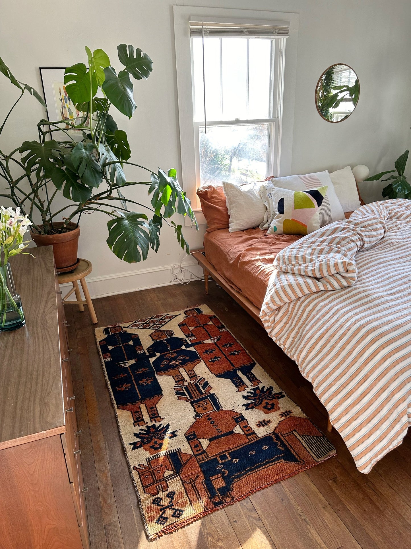 See Binia Persian Rug Next to a King Size Bed
