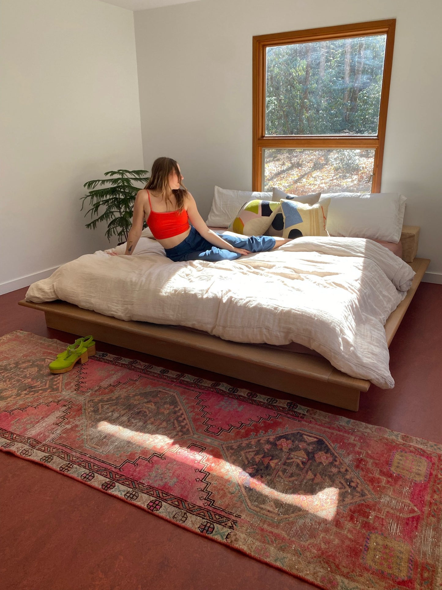 Style Ixora Pink Persian Runner Rug with a King Size Bed