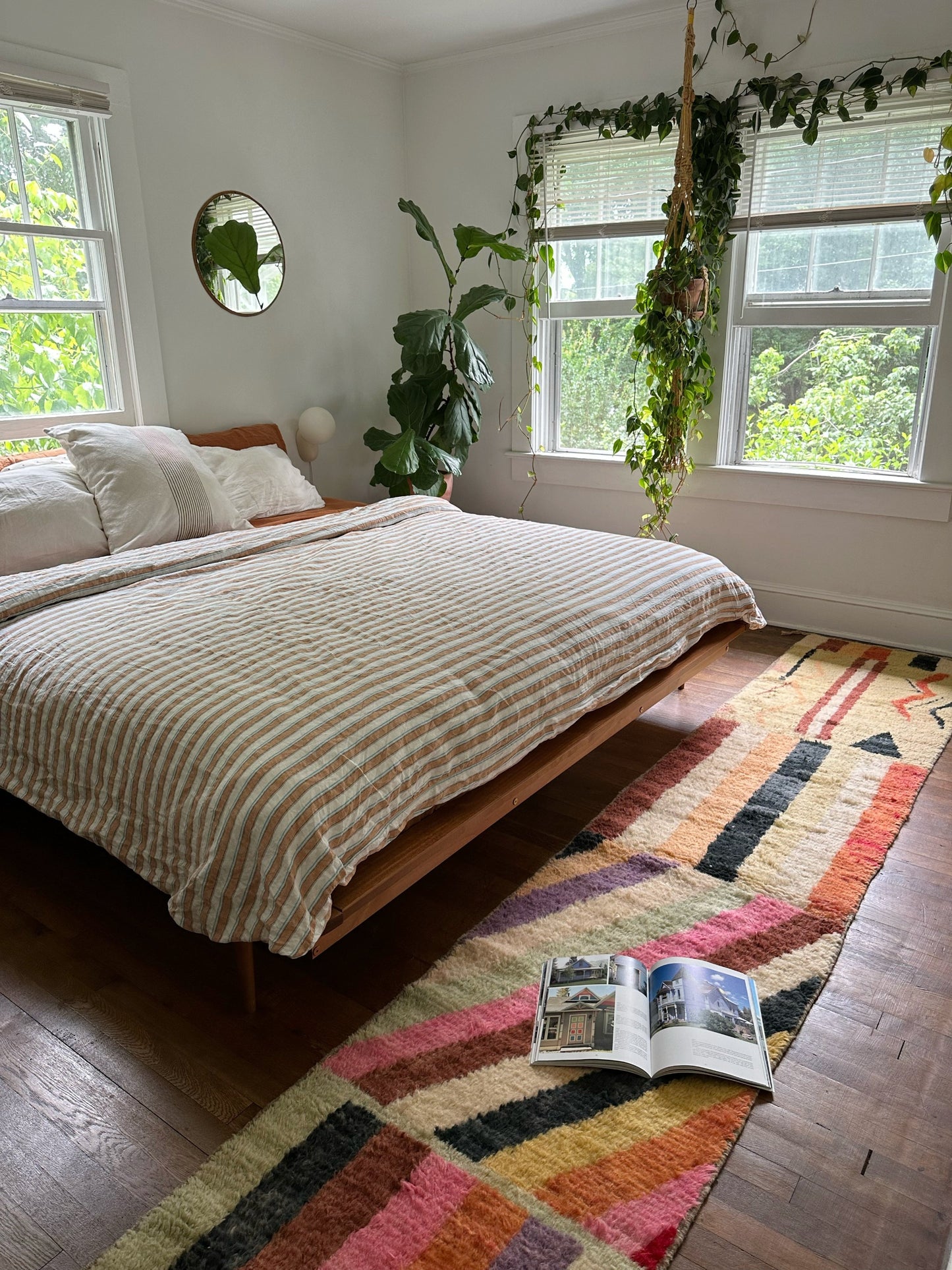 A book lays open on Larache Moroccan Runner in a bright room