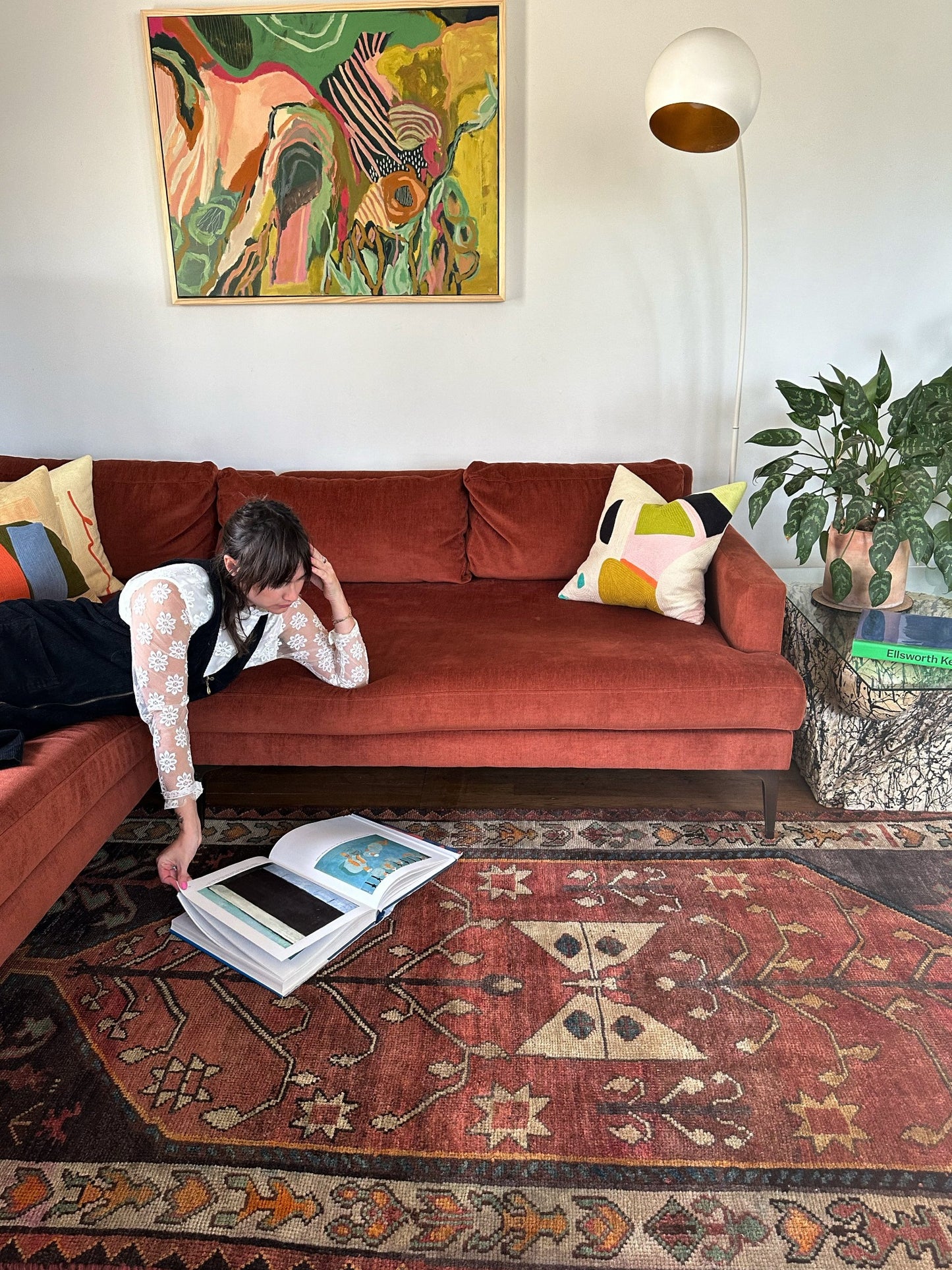 See Arelia Persian Rug with a Sectional Couch