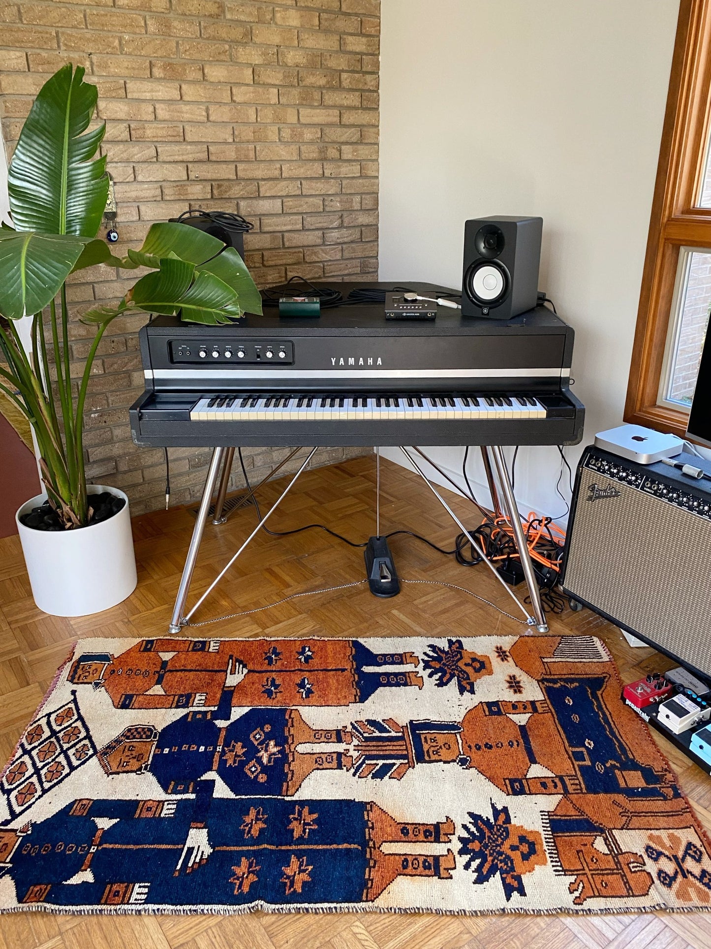 See Binia colorful rug styled in a Corner Music Studio