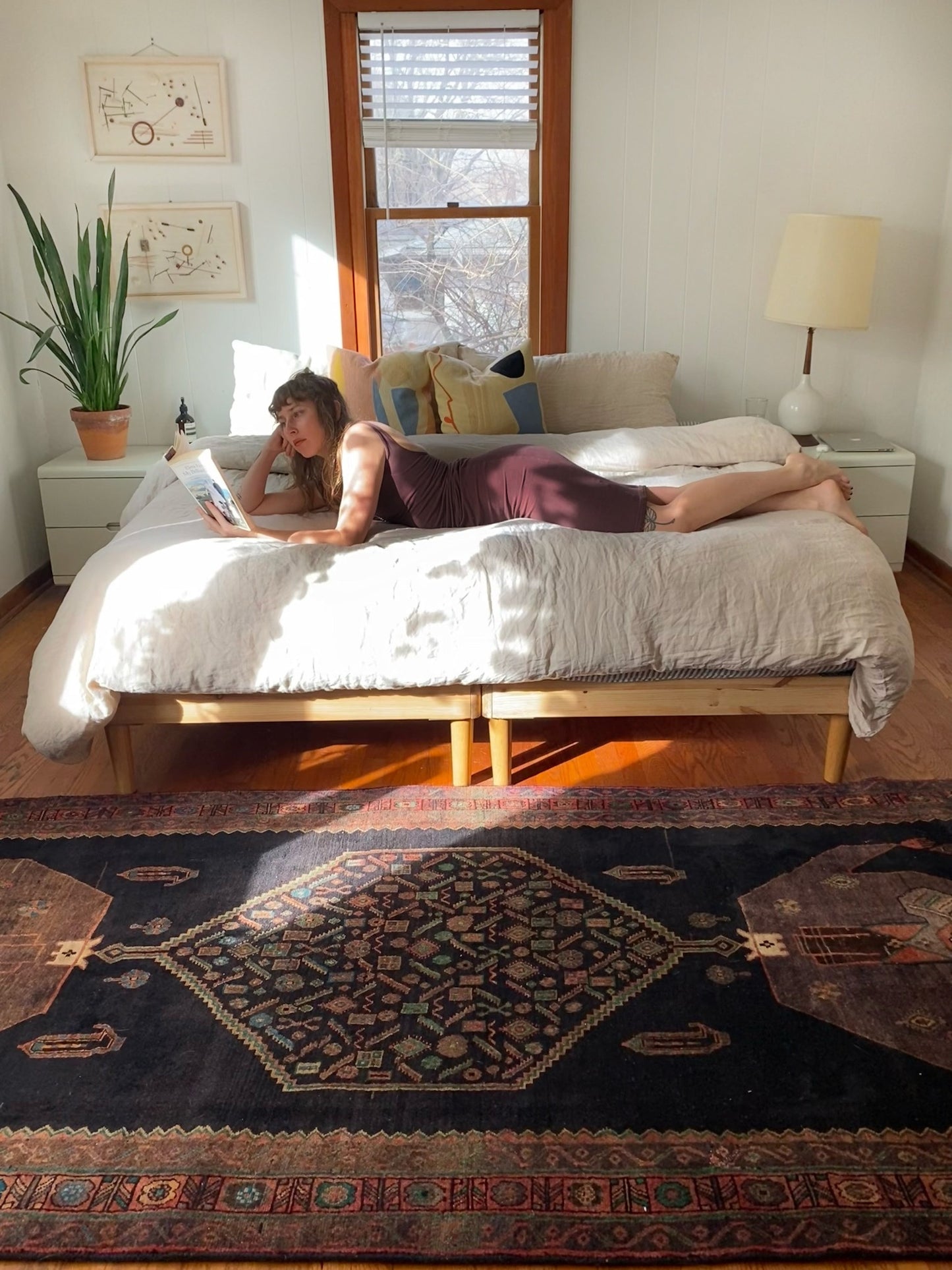 Dark Persian rug Style Palm by a King Size Bed