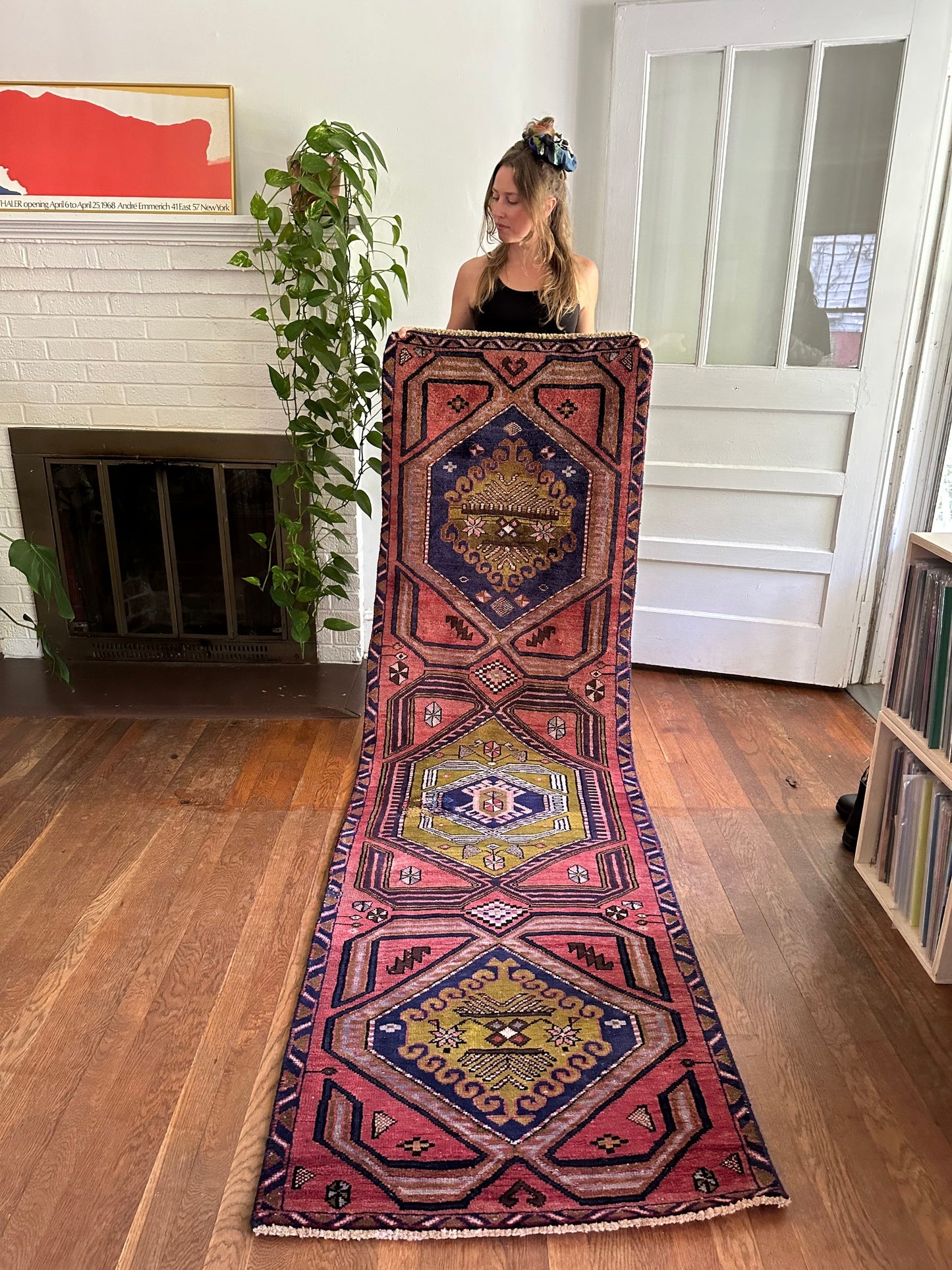 Time-Honored Runner Rug: Vintage Creation, Handwoven with Terracotta Base and Central Indigo plus Mossy Green Designs. The "Abrash" Phenomenon, Reflecting Antique Dye Variations, Adds Character. Wear Evident, Yet Maintains a Good Vintage Condition.