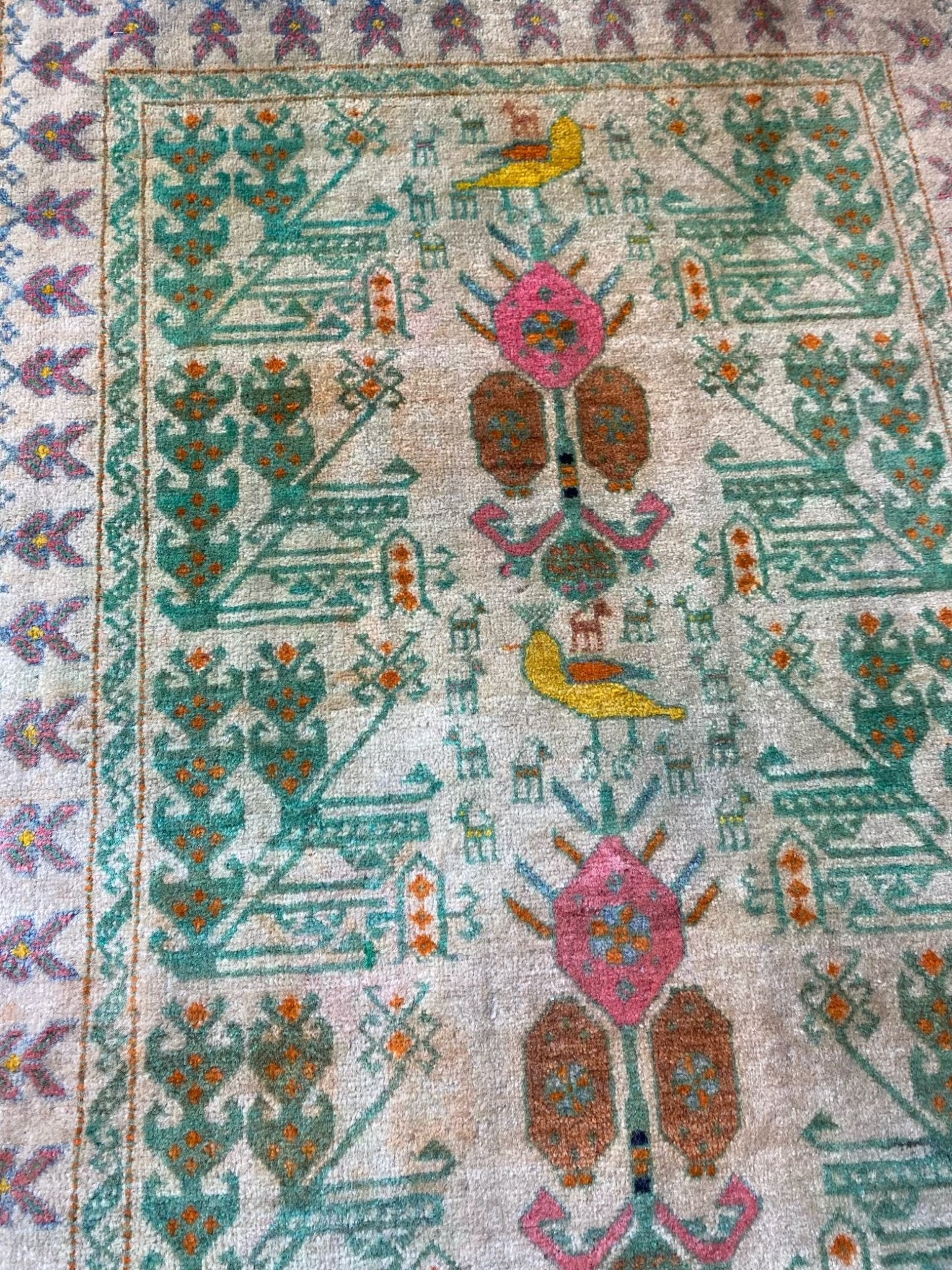 See Floral and Bird Motifs in Vintage Persian Rug