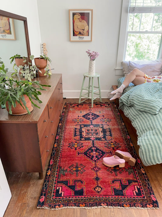 See Vintage Red and Marigold Persian Rug in a Bedroom