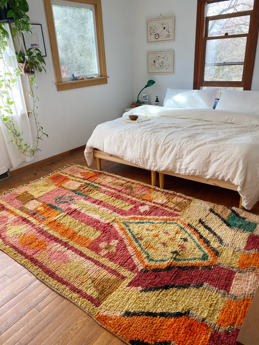 Style Janes Moroccan Rug with a King Size Bed