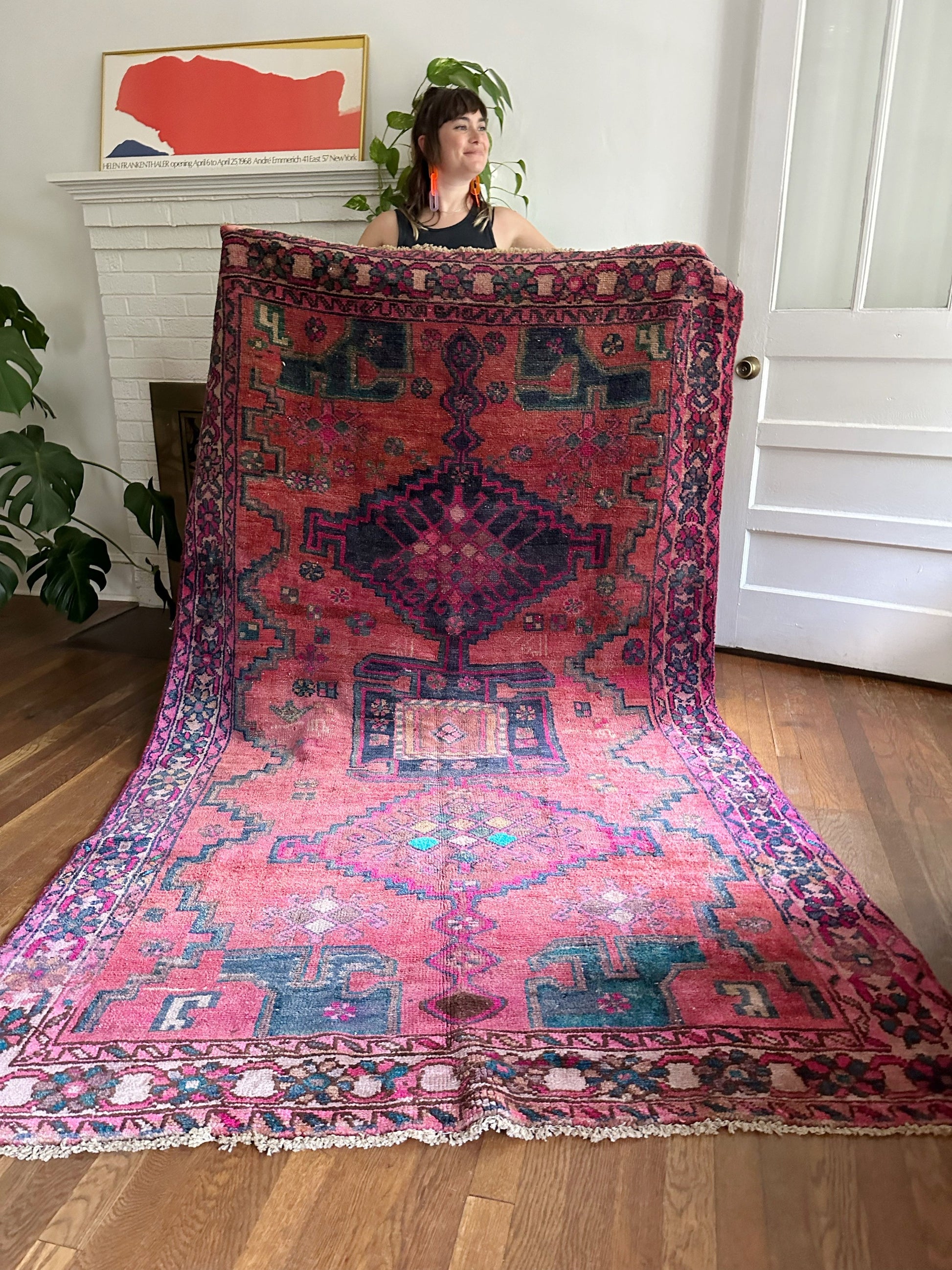 Holding picture of Oak Persian rug shows how gorgeous it is in the light