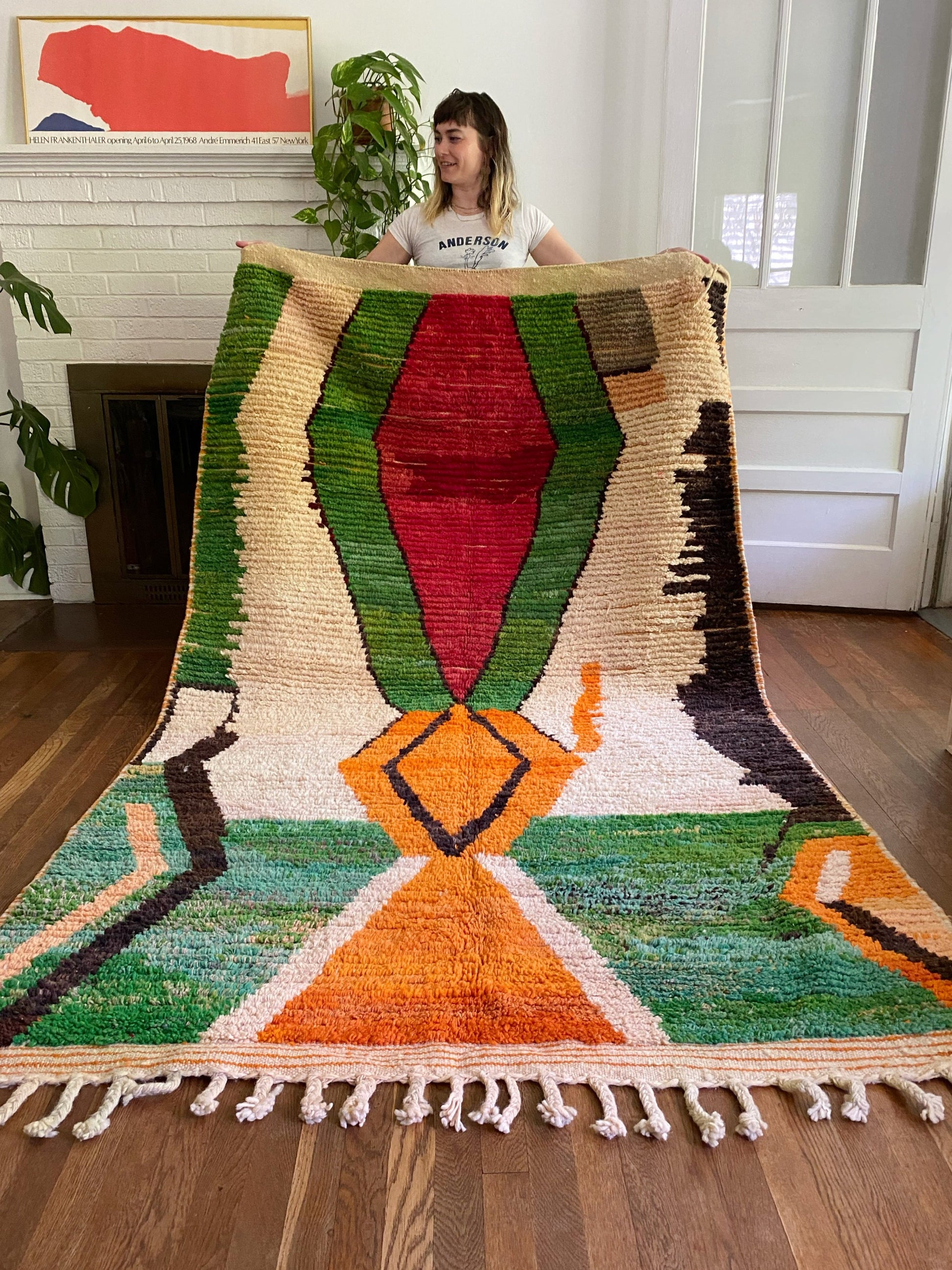 Holding photo of Sikora Moroccan Rug highlights the abstract design