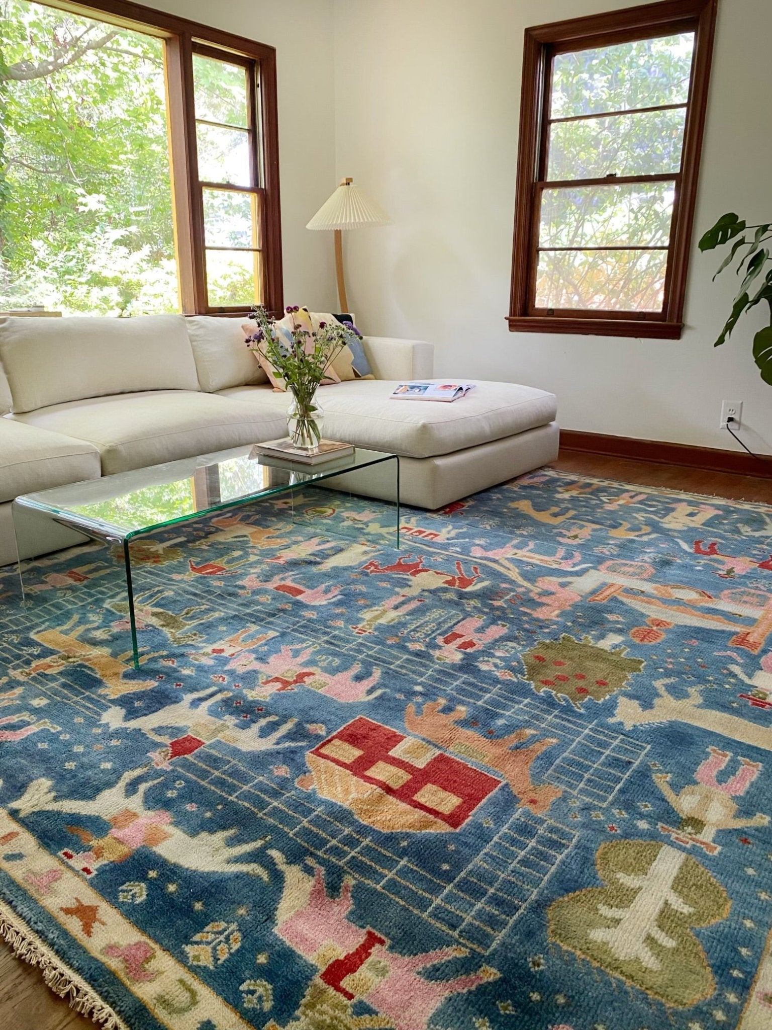 See Blue Pictoral Area Rug in a LIving Room