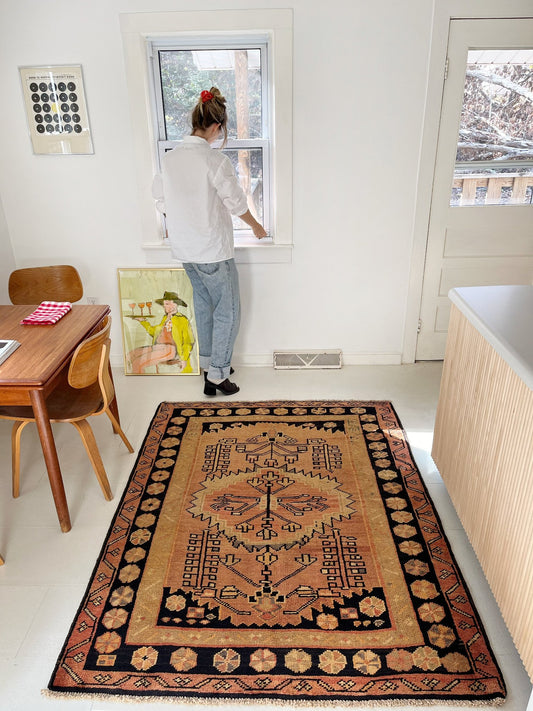 Style a Vintage Persian Earthy Rug in a Dining Room