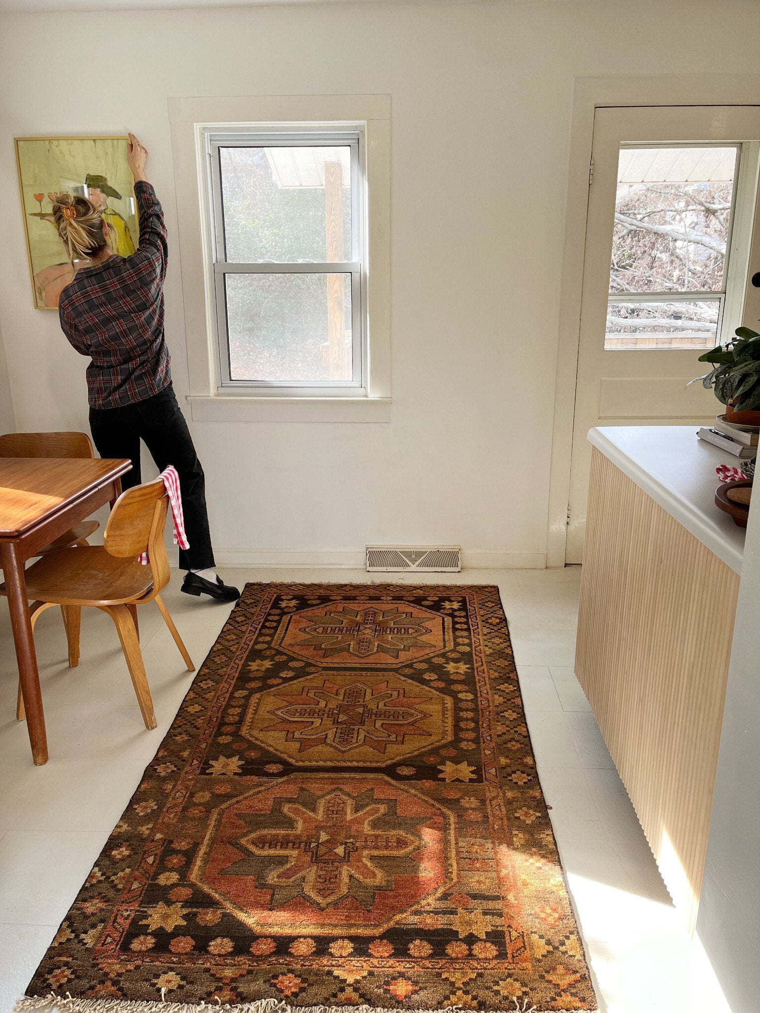 See Vintage Persian Area Rug in a Dining Room