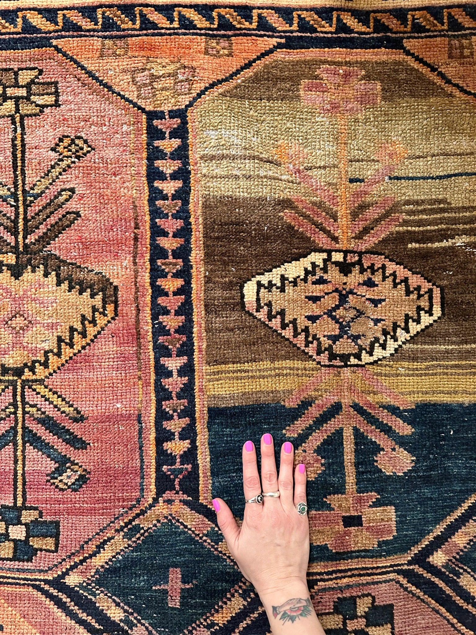 Abrash rugs in detail, closeup of pink floral print