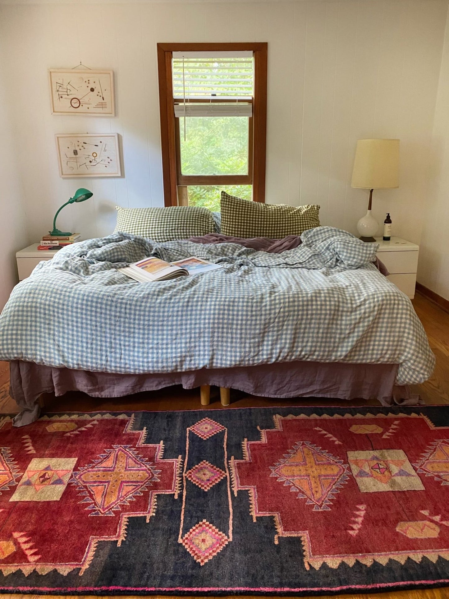 Enhance a Cozy Bedroom with a Vintage Rug at the Foot of the Bed