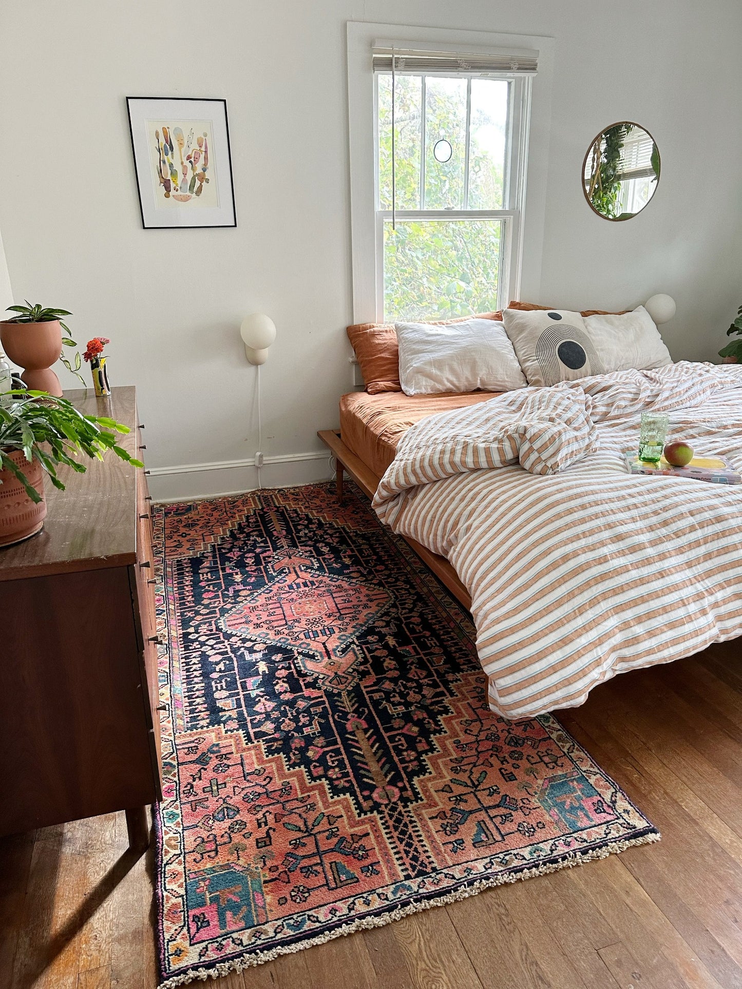 Wreath Persian Rug styled in a bedroom really makes the room pop.