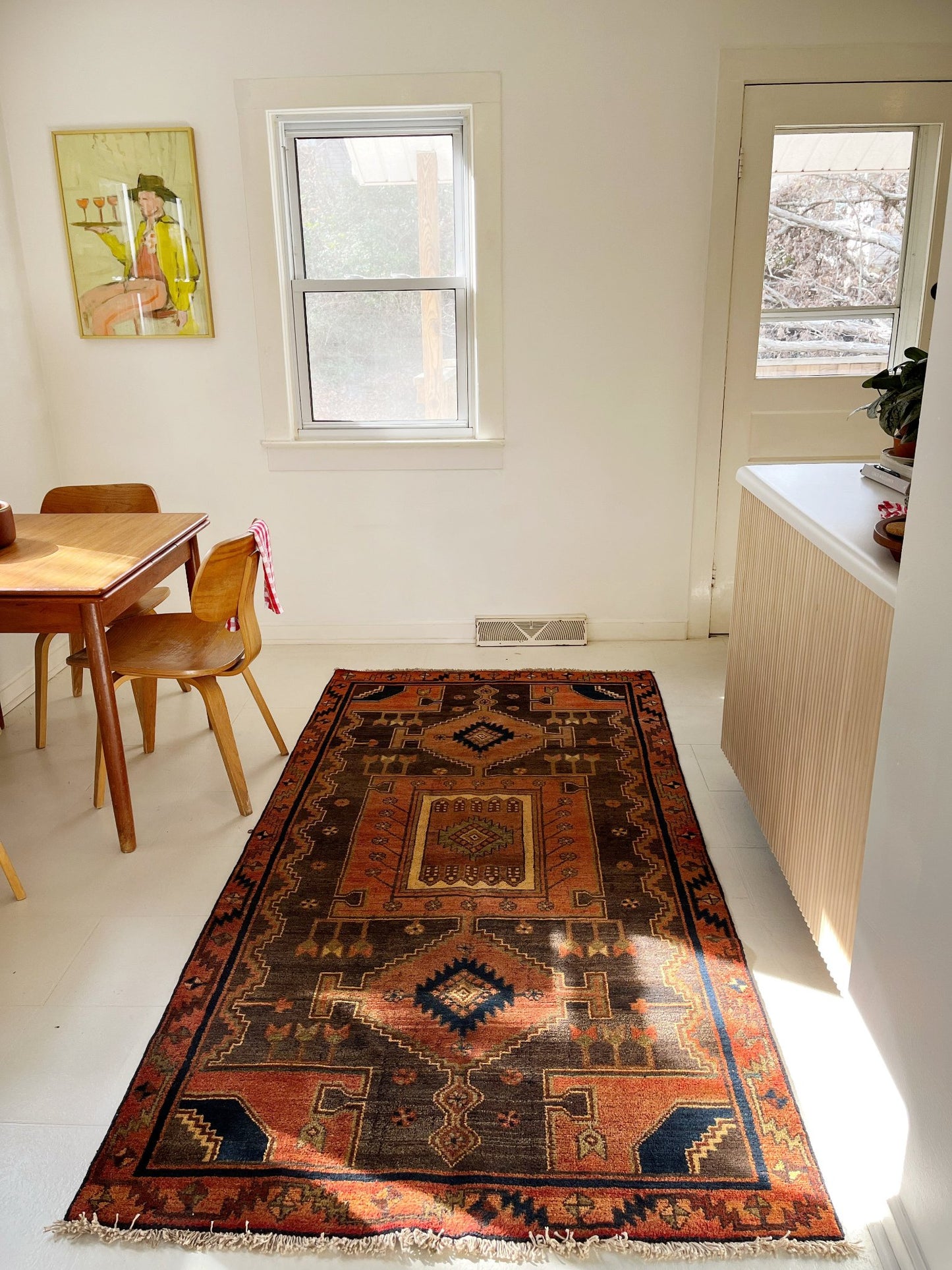 Style a Dining Room with a Vintage Persian Area Rug