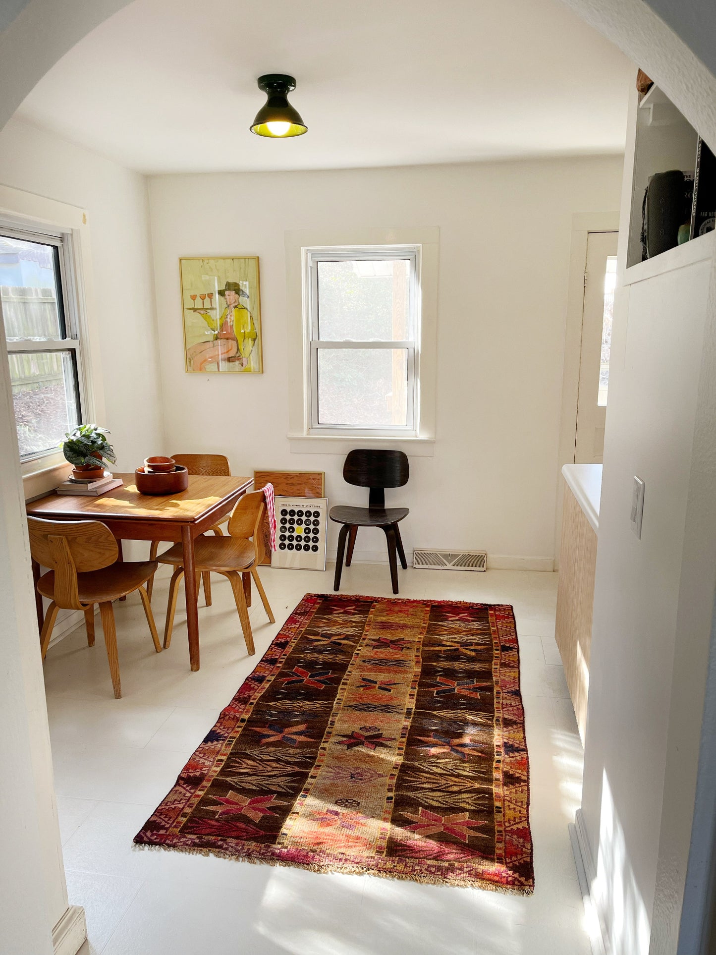 See a Dining Room styled with a Vintage Persian Rug