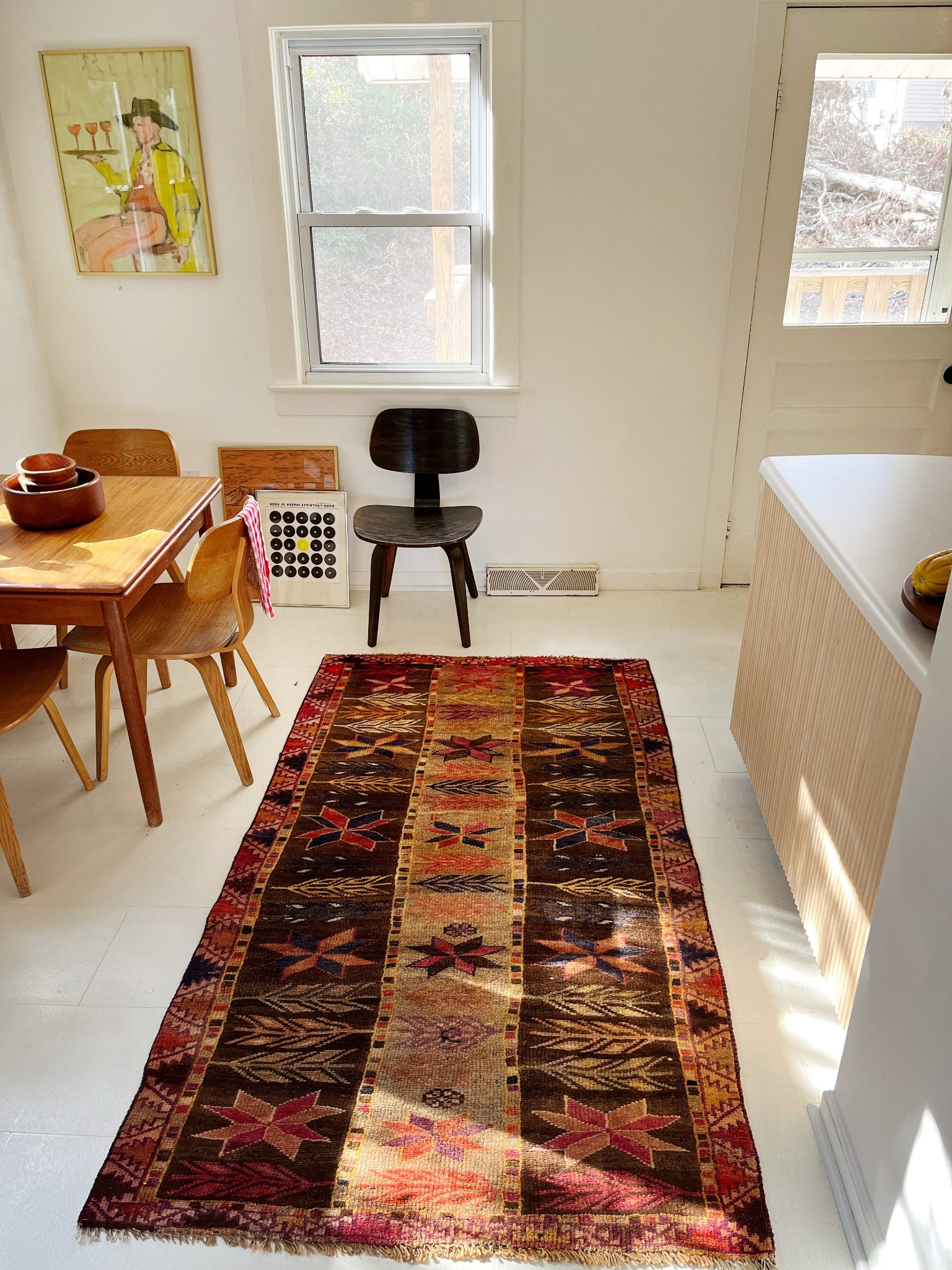 See a Dining Room Enhanced with a Vintage Persian Rug