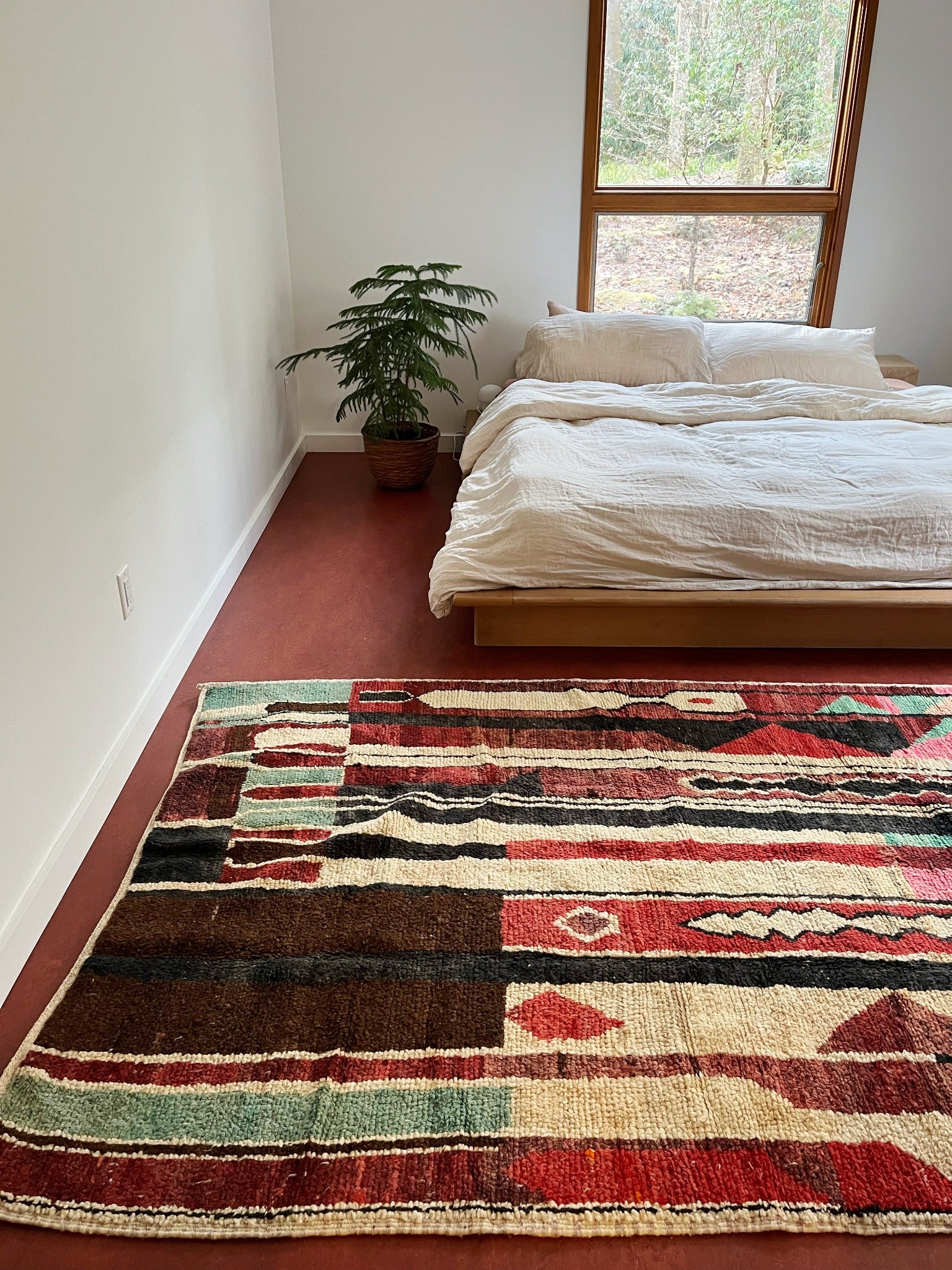 See Ponderosa multi-color Moroccan Rug Styled in a Bedroom