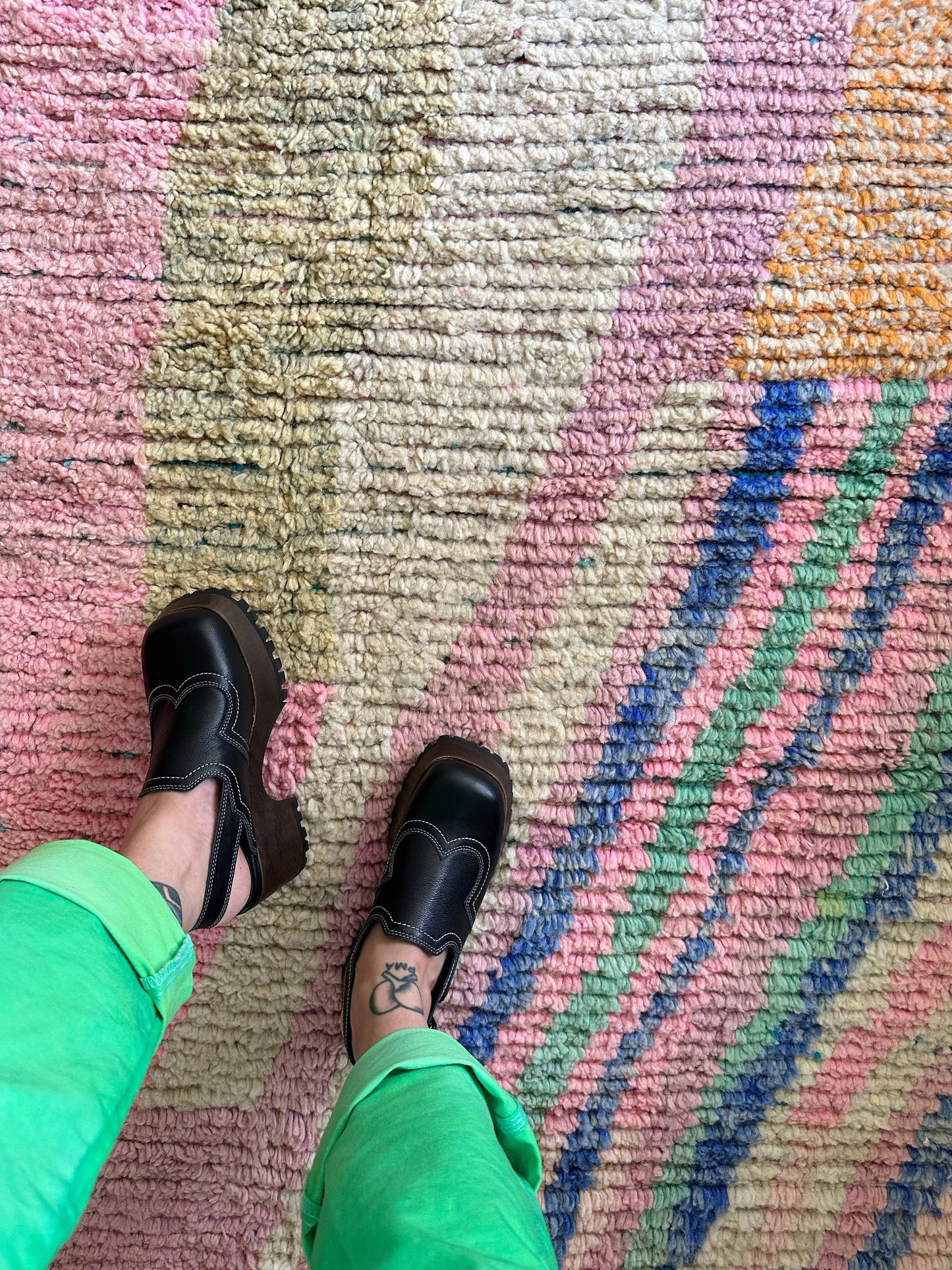 Detailed shot of Flora Moroccan rug shows the fun pastel stripes.