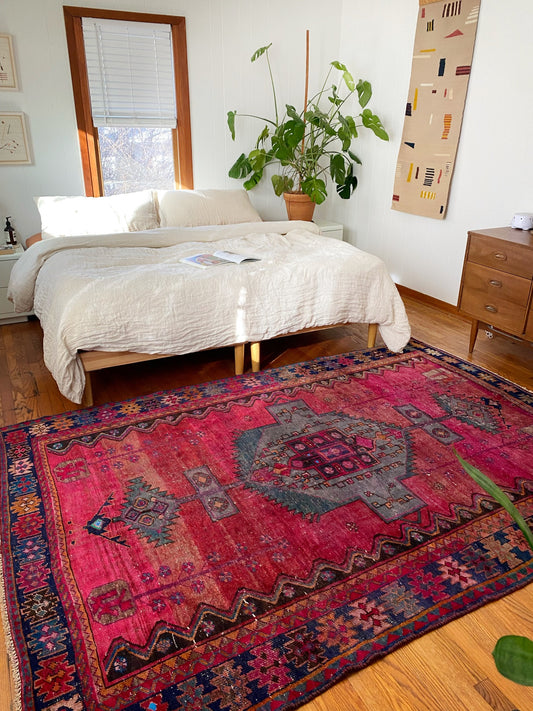 See Pentas pink Persian Rug Styled in a Bedroom