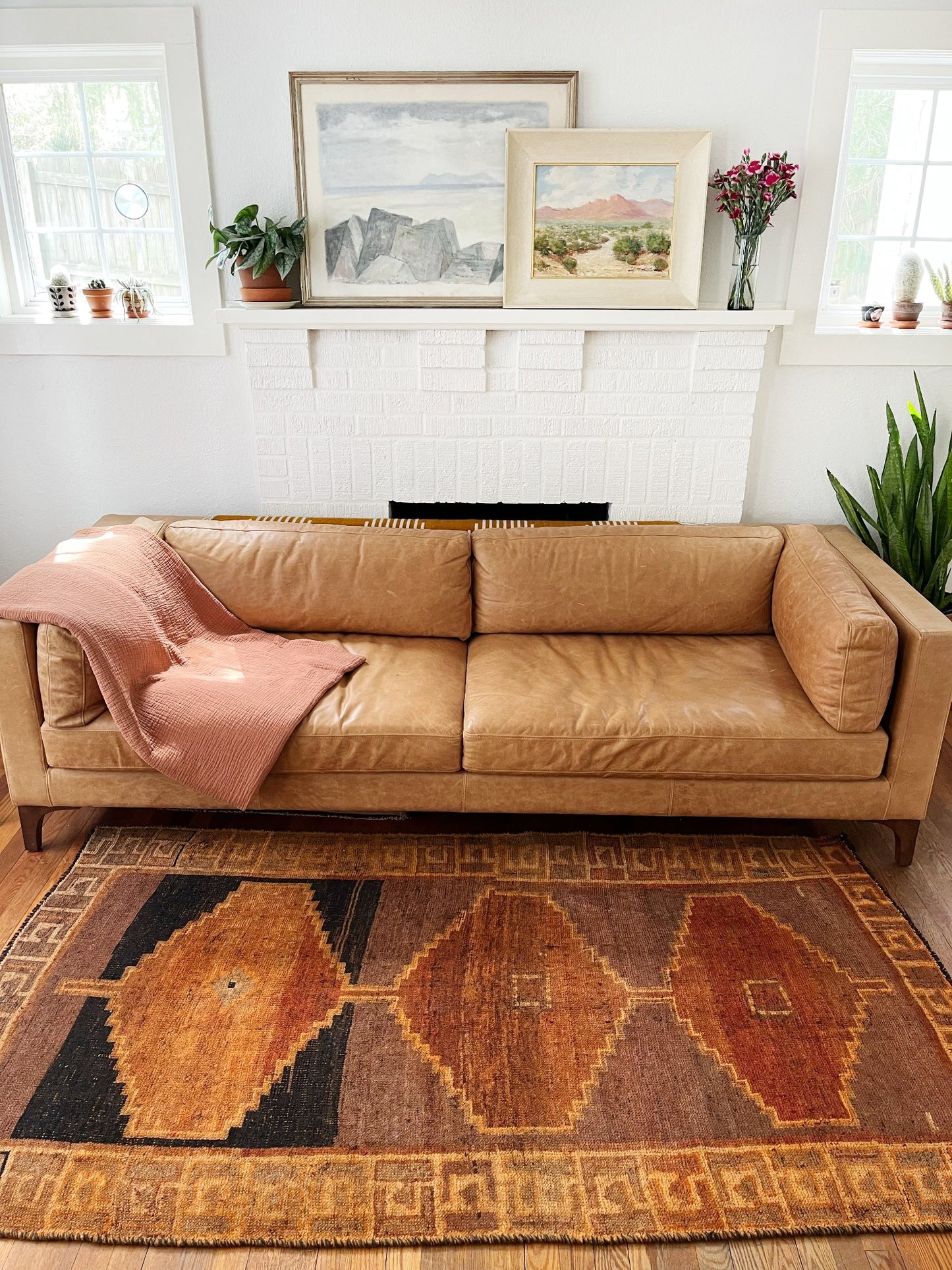 See Vintage Persian Orange Earthy Rug Styled in a Living Room