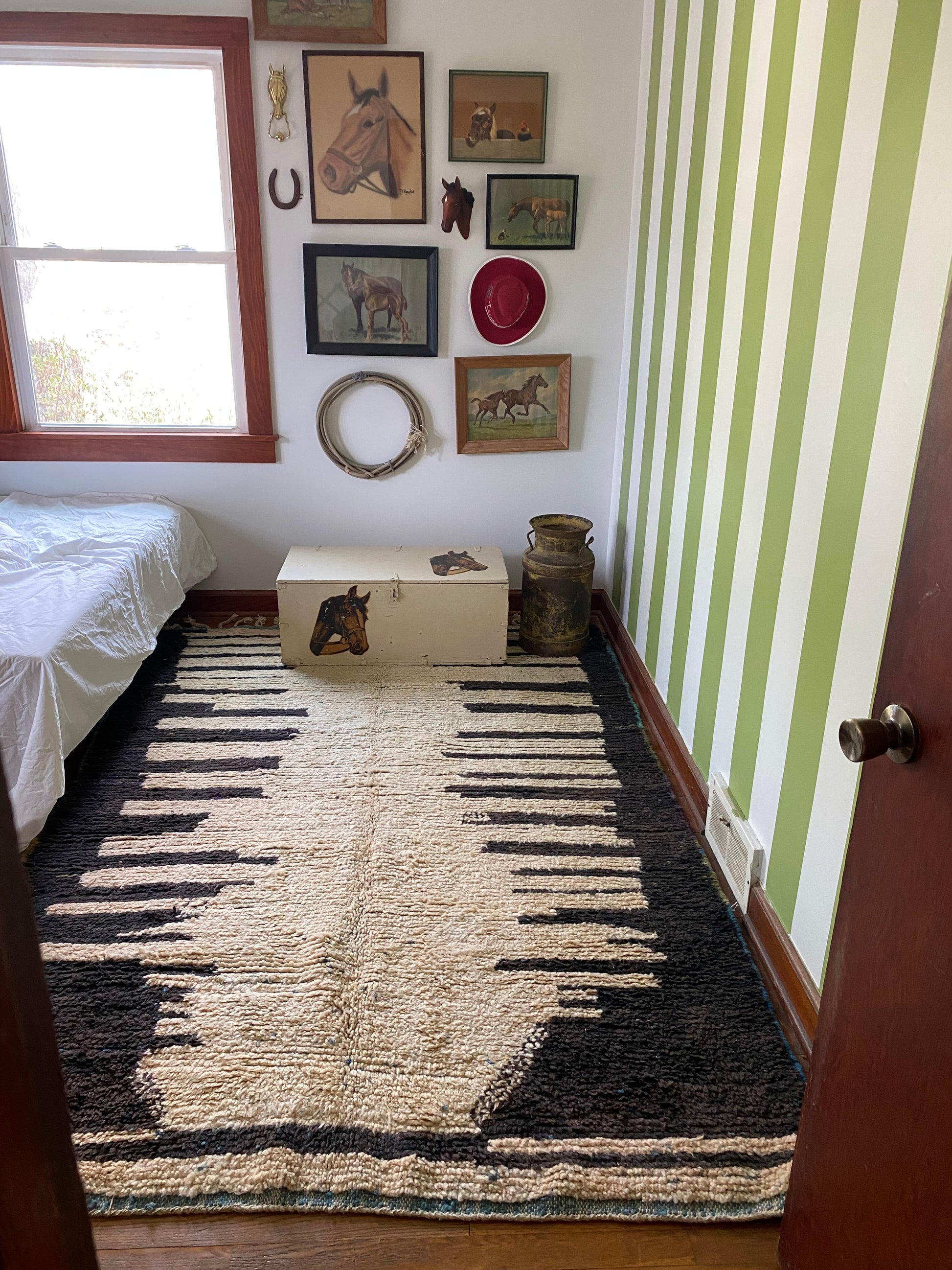 irregular shaped rug black and charcoal styled next to bed