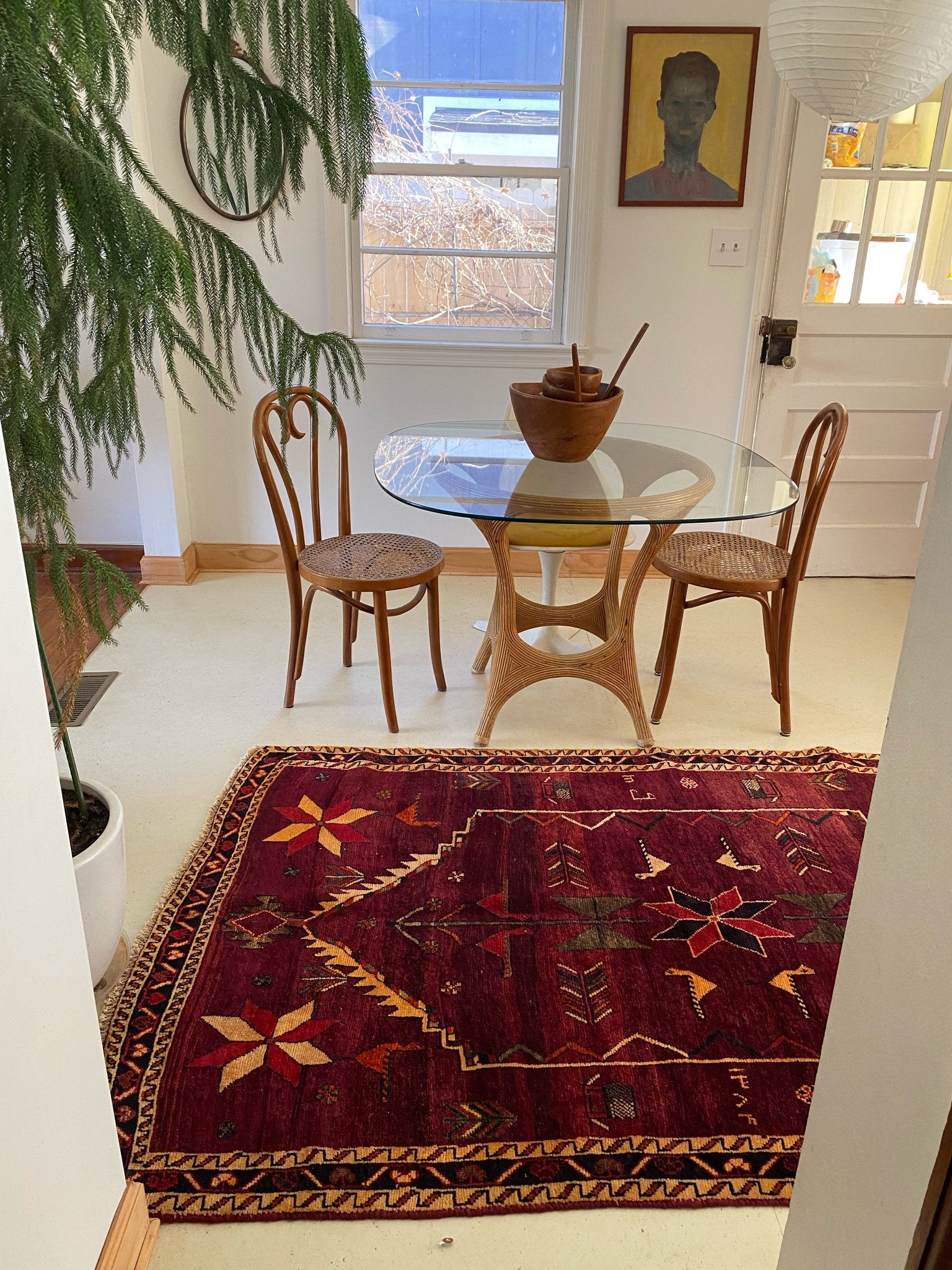 See a Dining Room Styled with a Burgundy Vintage Area Rug