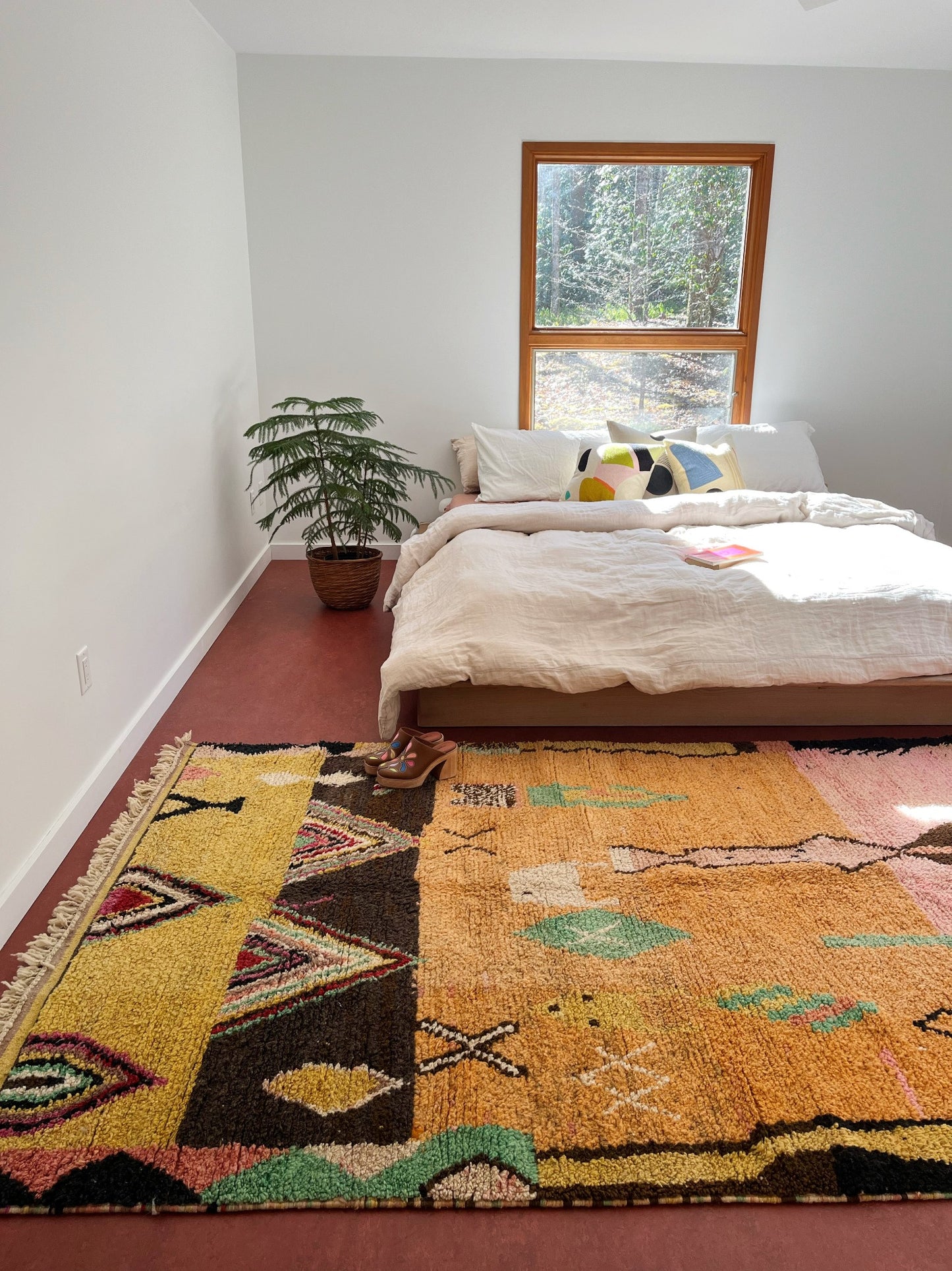 See Gil Moroccan Rug Styled with a King Size Bed in a Primary Bedroom