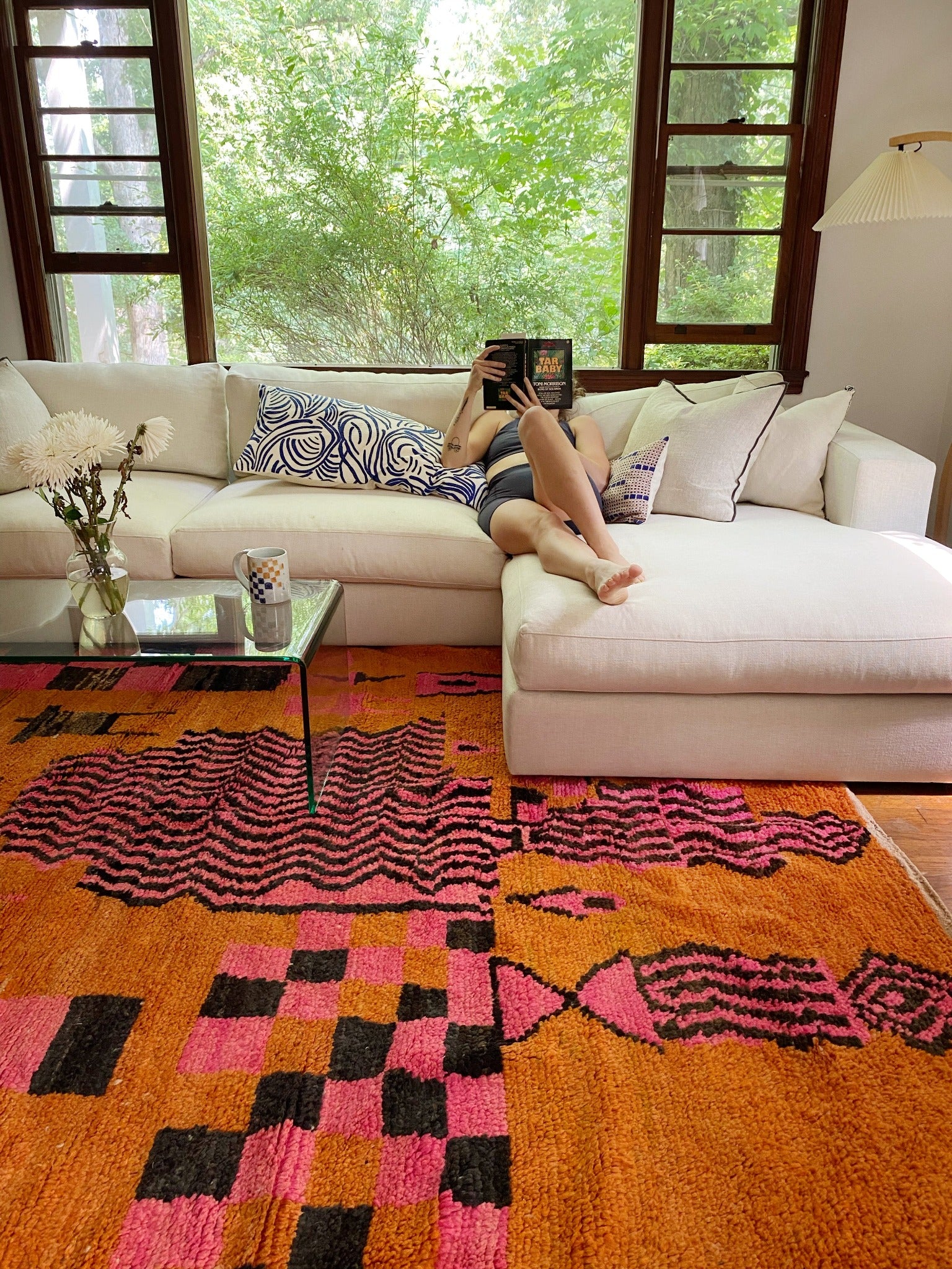 A bright tangerine and hot pink rug add so much character and depth to a living space.